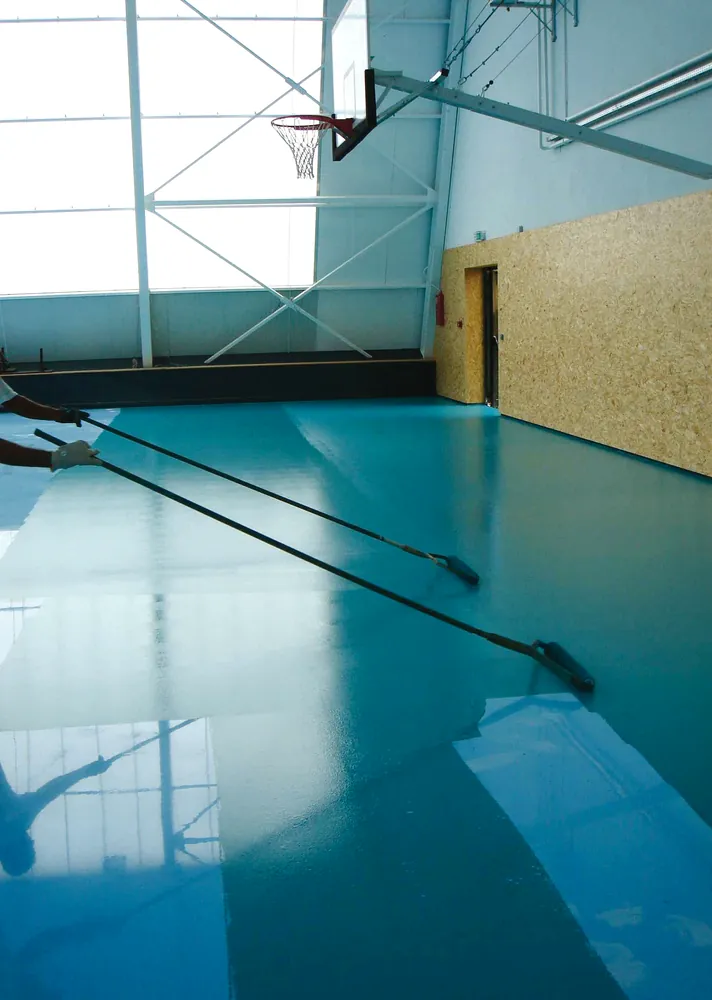 Installation of ECO-SPORT ROLL as a subfloor for indoor sports flooring